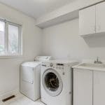 Image of the washing and drying machine inside the Laundry at 42 Dragon Tree Crescent